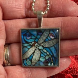 23” ball chain w/ 1” square pendant of blue colored dragonfly.  Clear front NIP